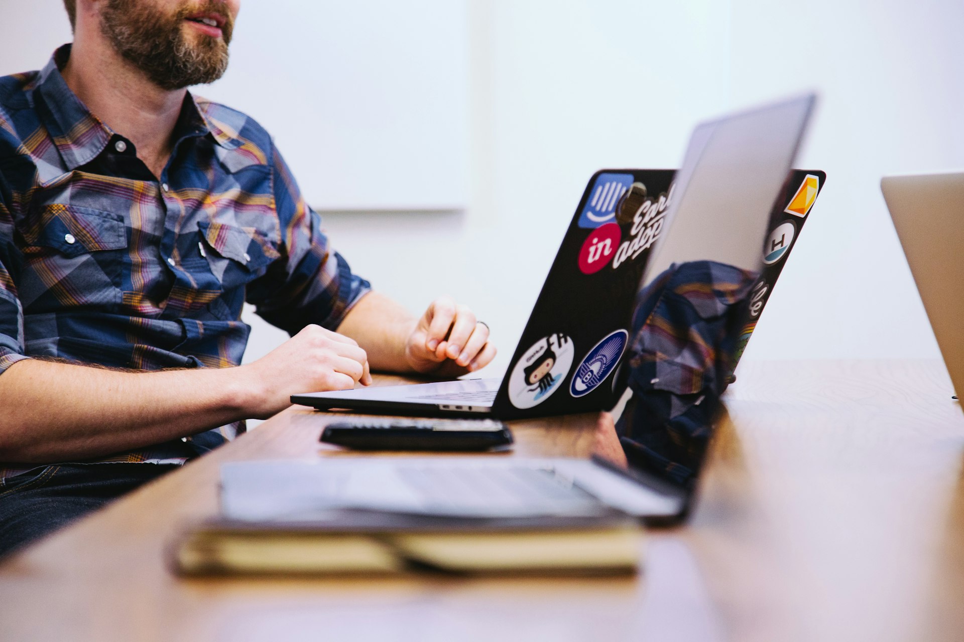 man sitting in front of laptop